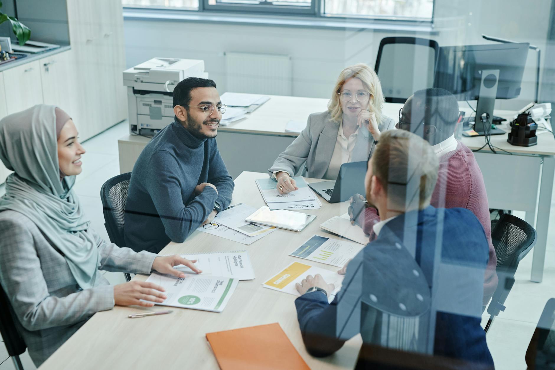 A Diverse Group Of Professionals Engaged In A Meet