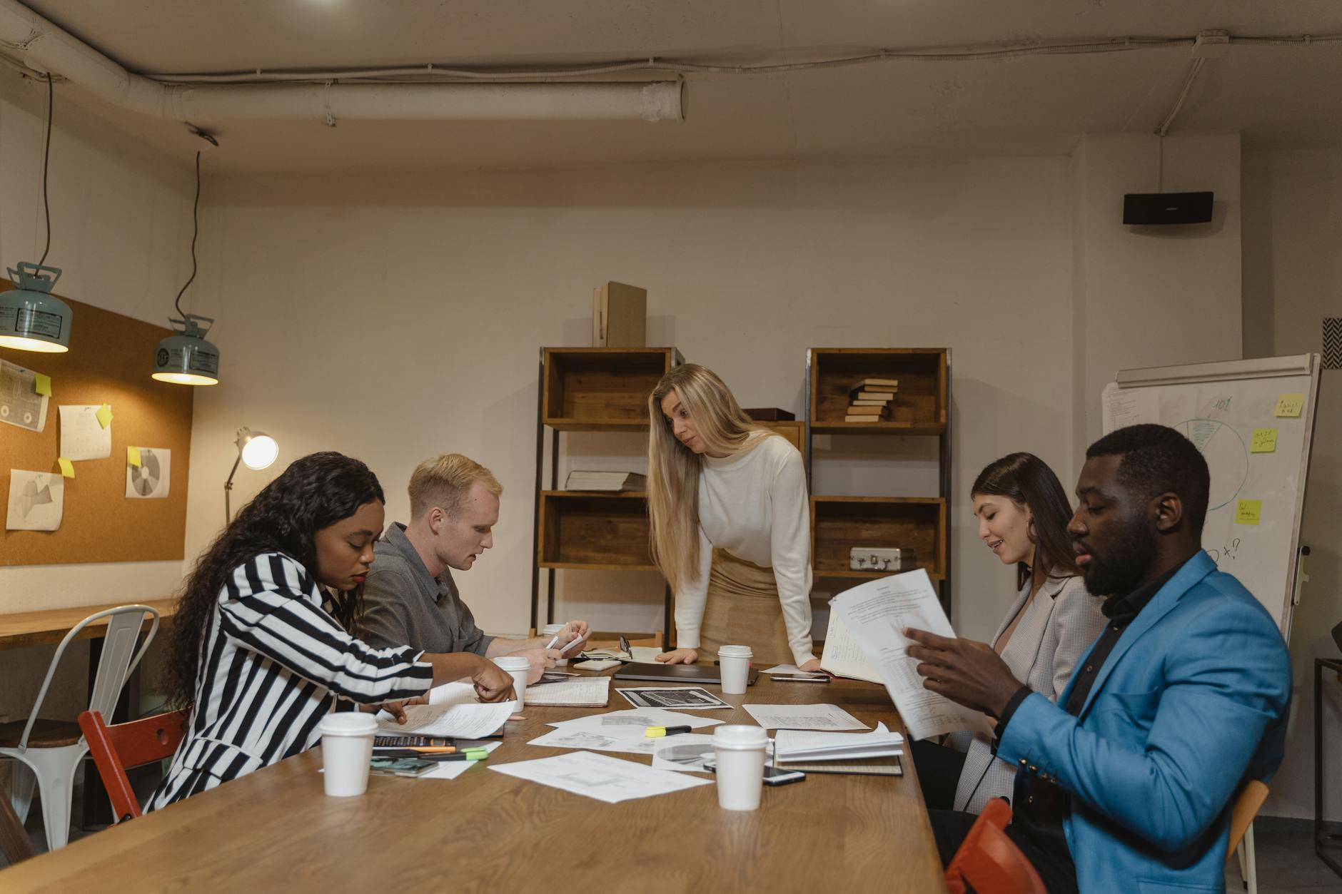 A Multicultural Group Of Professionals Engaged In 1 2