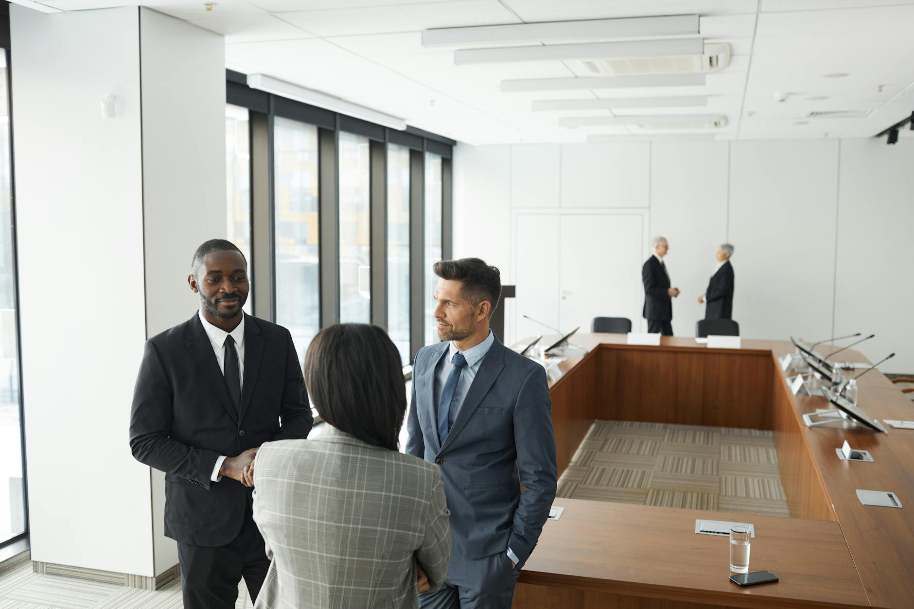 Business Professionals Engaging In A Meeting In A 1 1
