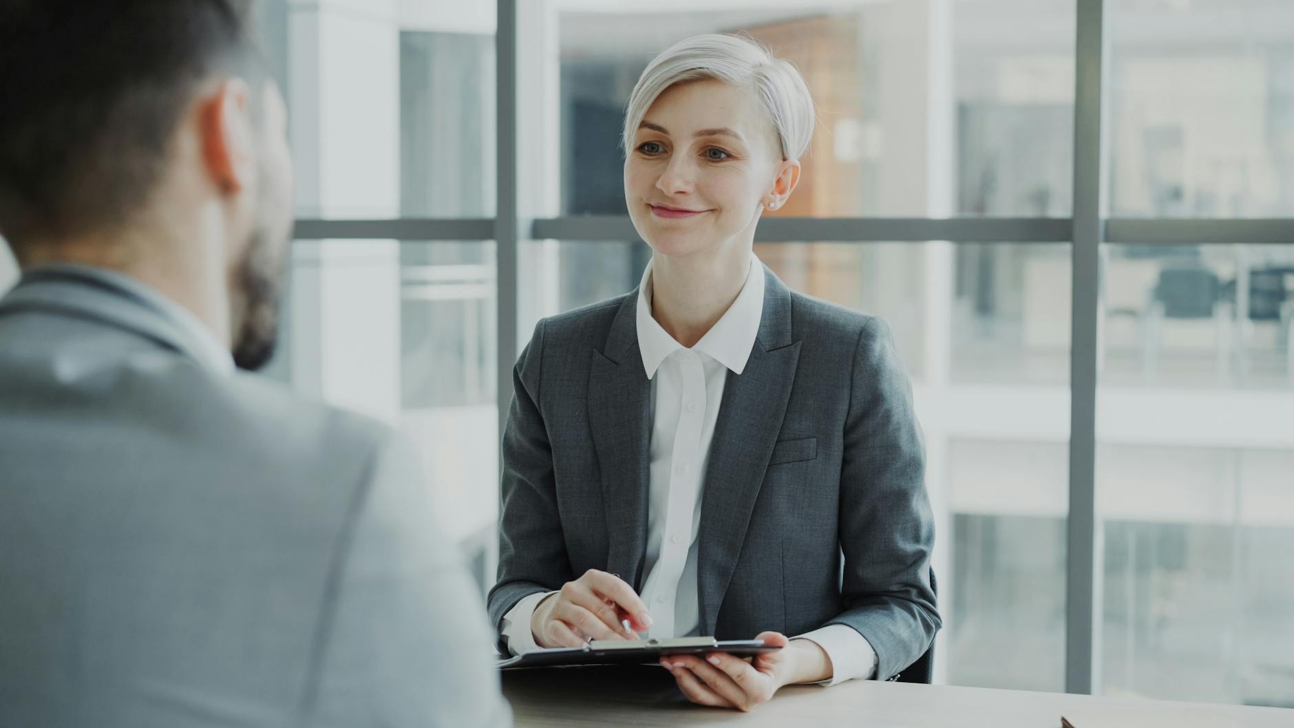 Professional Interviewing A Software Developer Candidate In A Modern Office