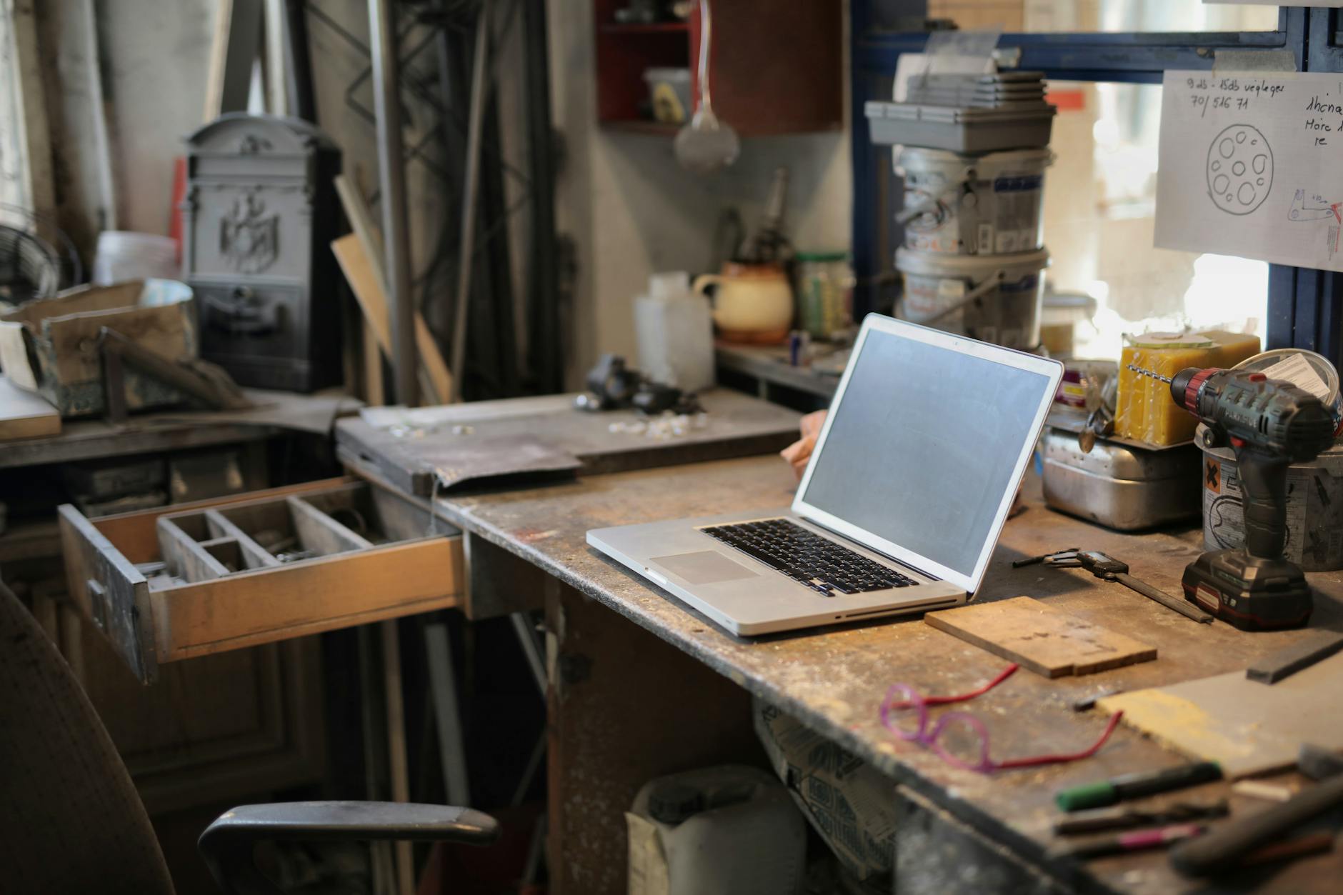 From Above Of Modern Laptop Laying At Table Among