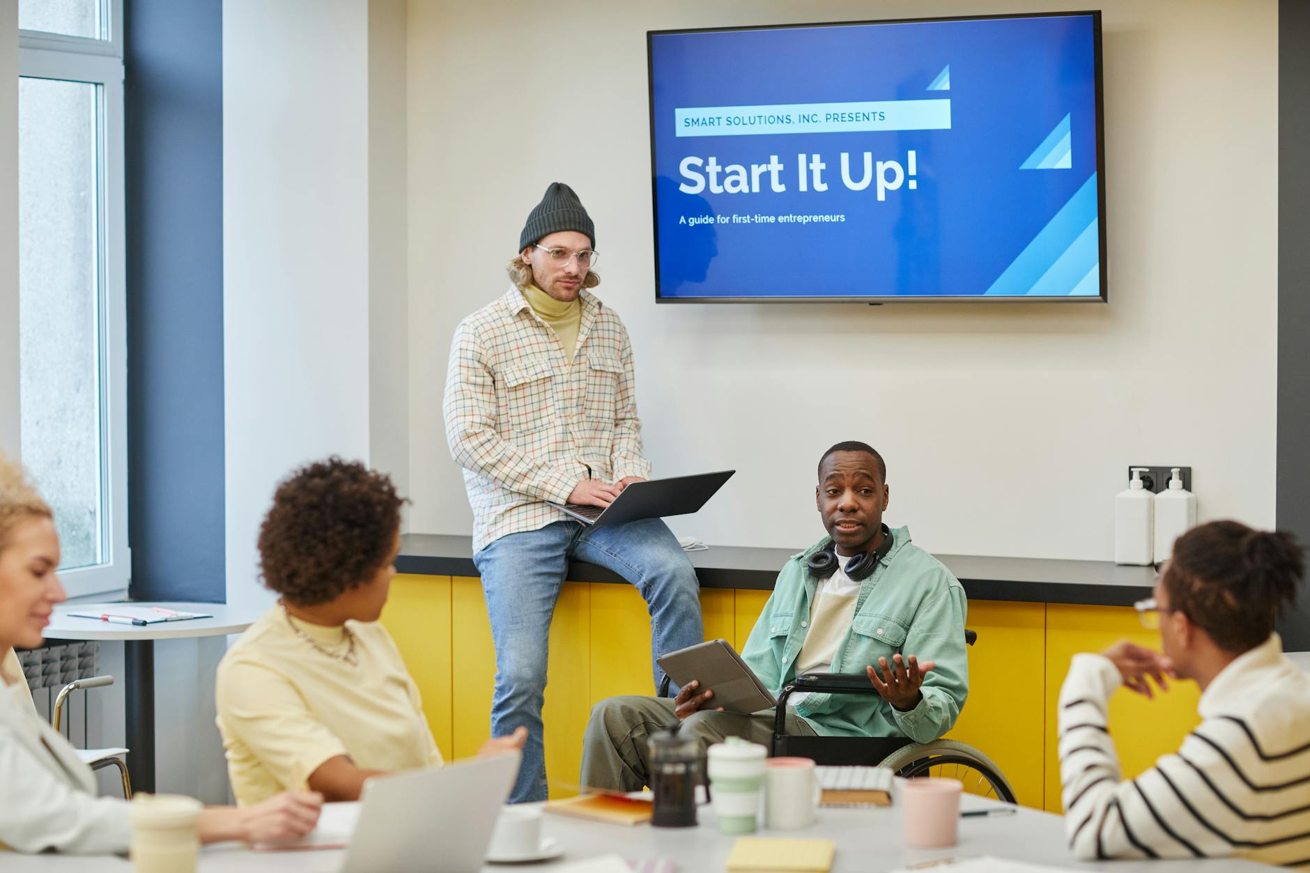Inclusive Team Meeting Discussing Startup Strategi 1