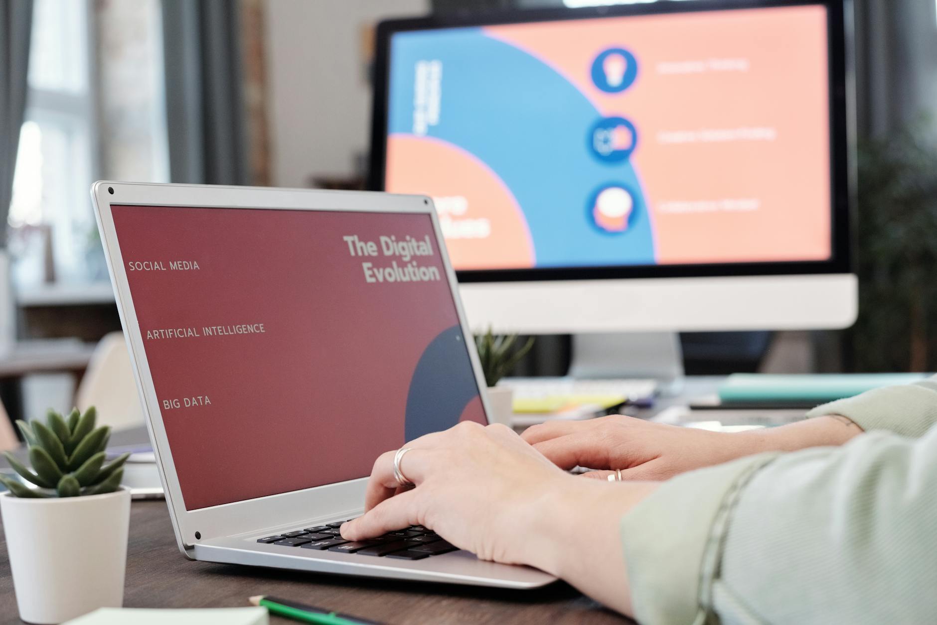 Laptop User Typing With Digital Evolution Concept