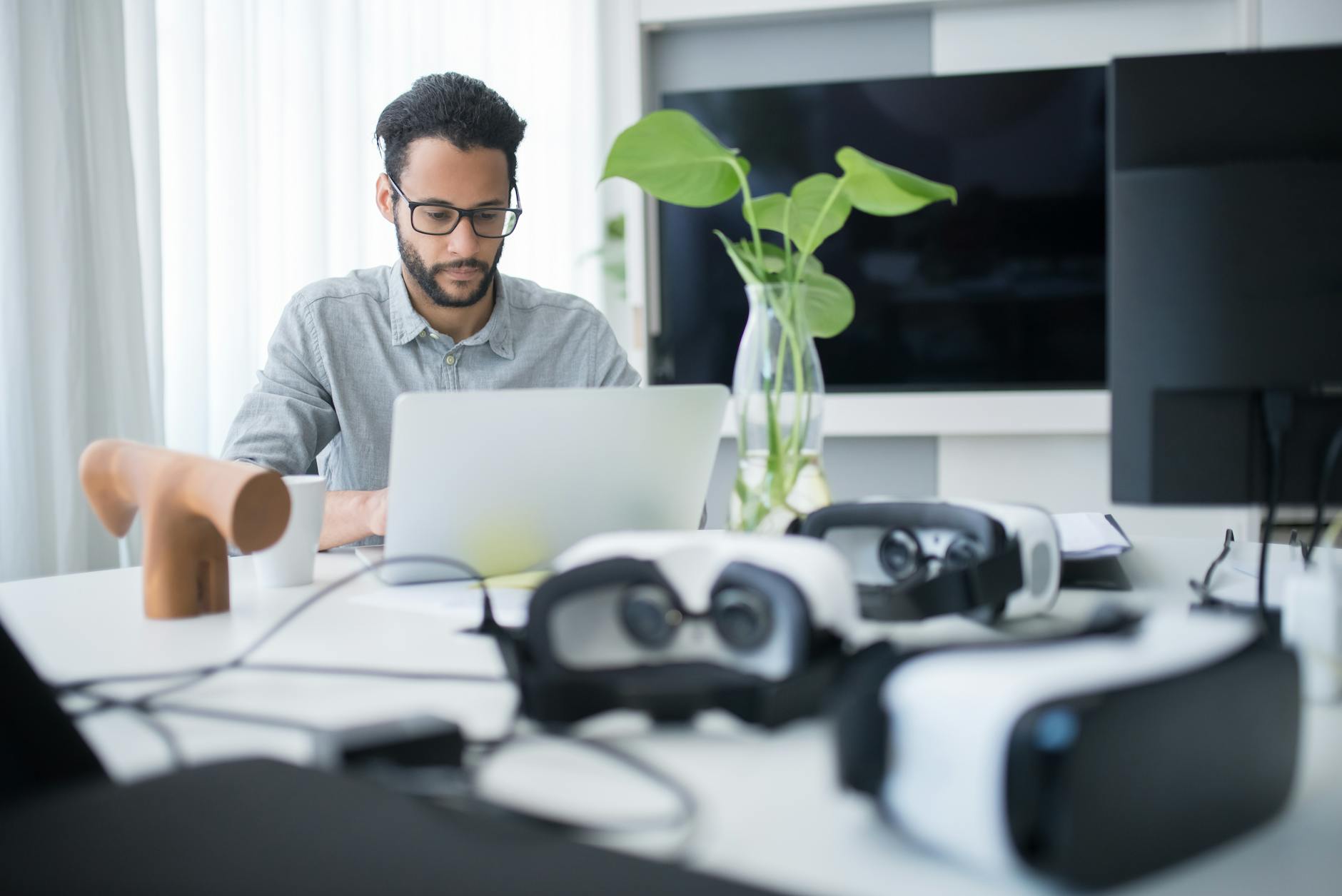 Man Focused On Laptop With Vr Goggles On Desk Mod
