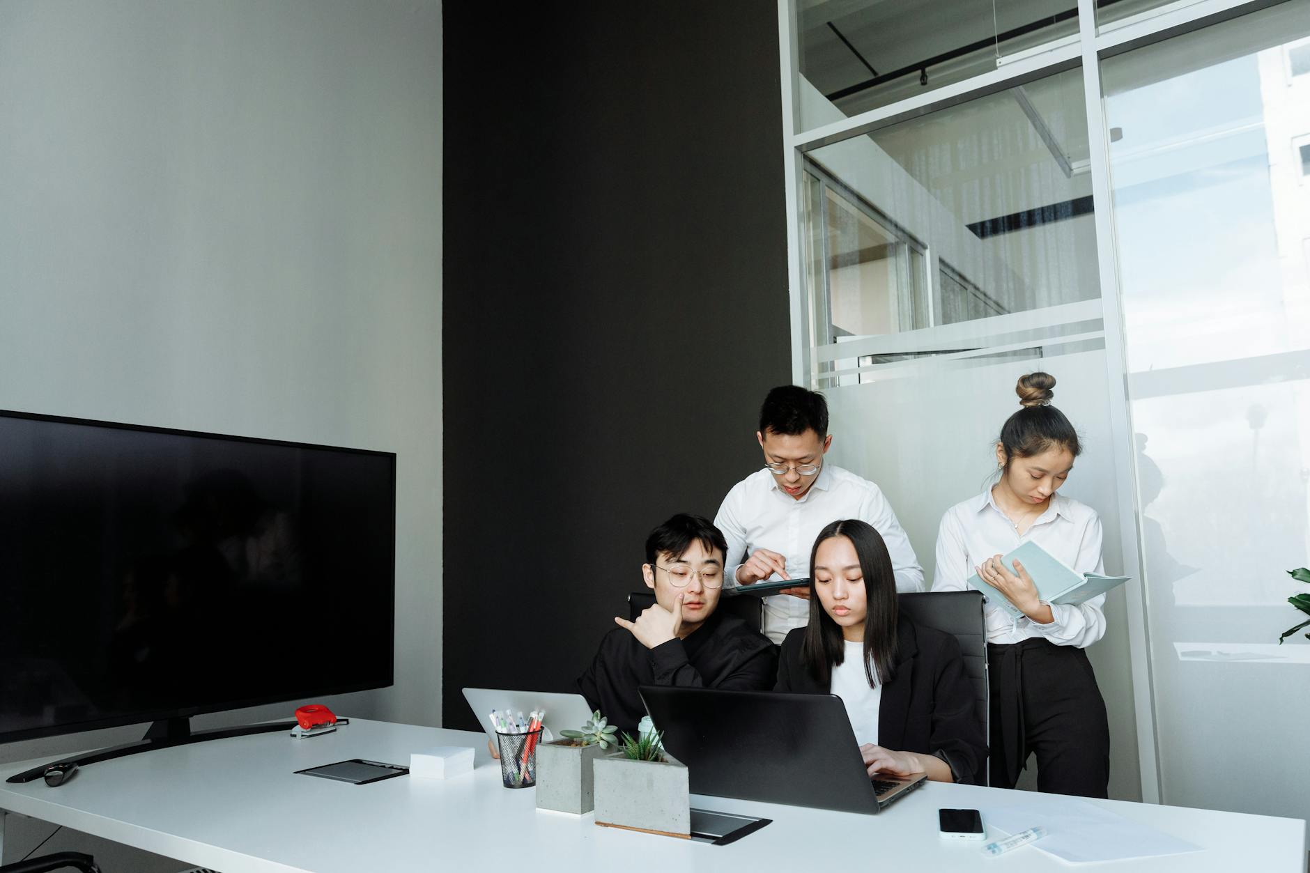 Team Of Young Professionals Collaborating In A Mod 1