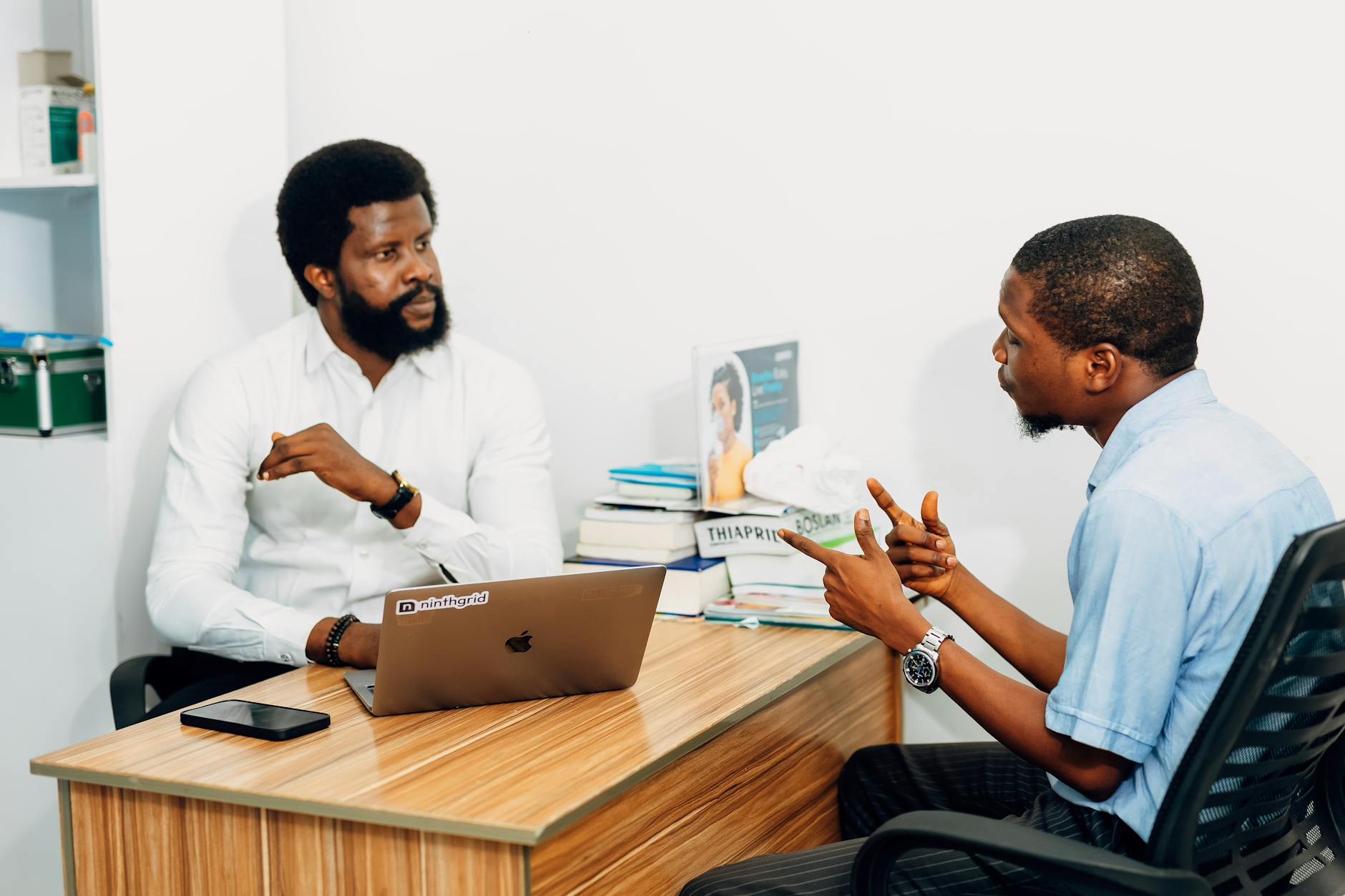 Two Adults Engaged In A Professional Consultation 1 12