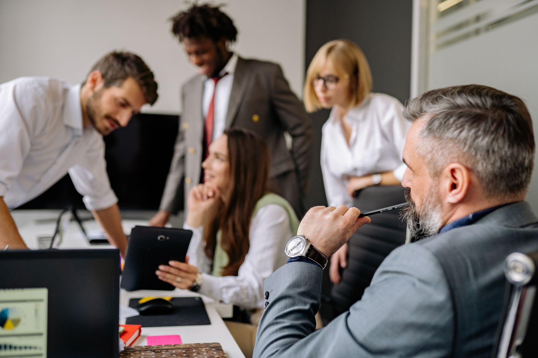 A Diverse Group Of Professionals Engaging In A Col