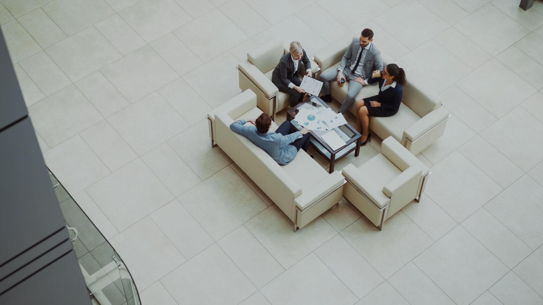 Revenue Growth Consulting: Expert Strategies For Business Success 3 Aerial View Of A Group Business Meeting In A Moder