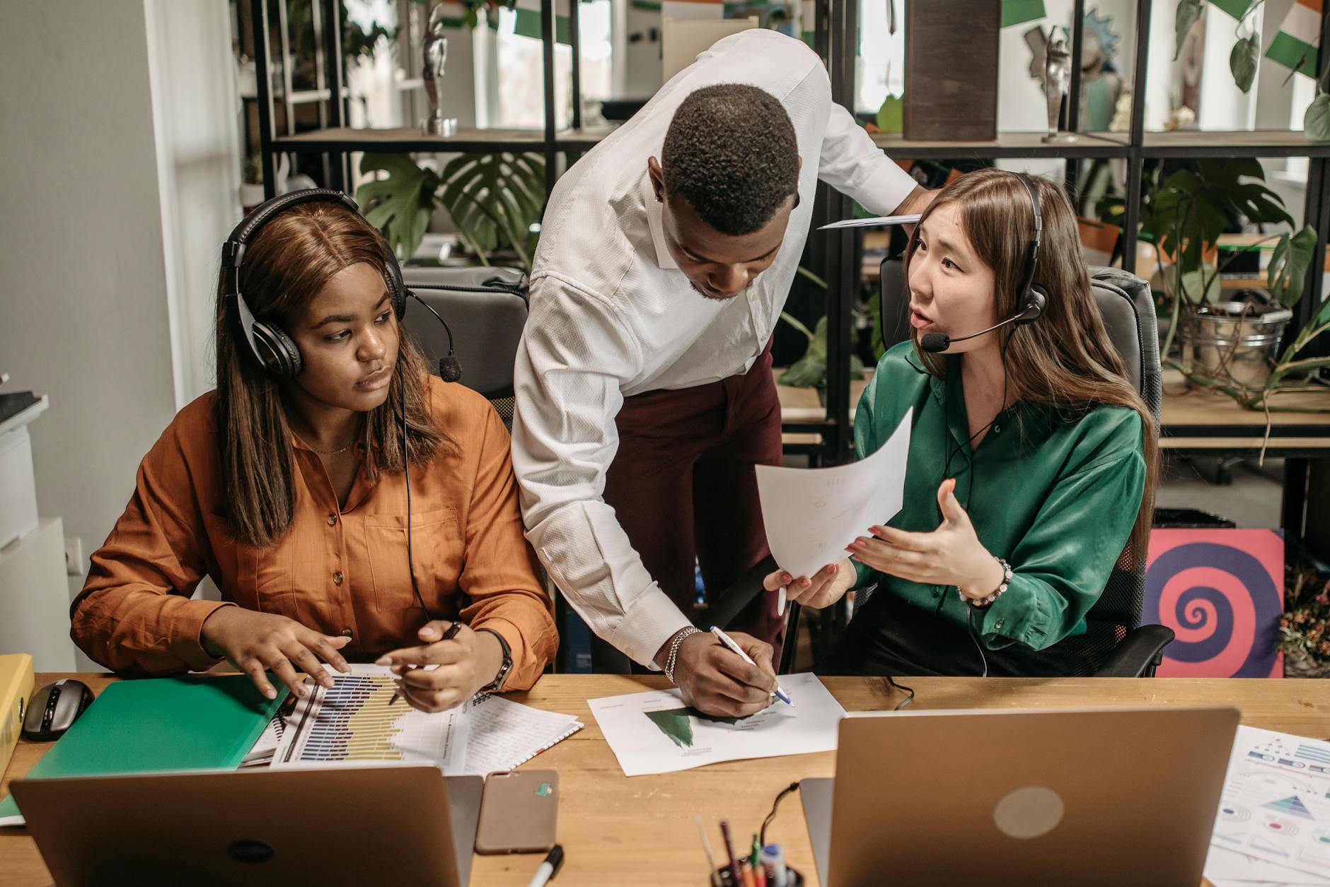 Diverse Team Collaborating In An Office Setting Wi