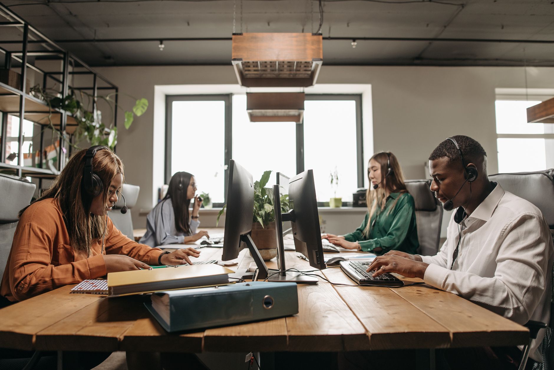 A Diverse Group Of Employees Collaborating With He