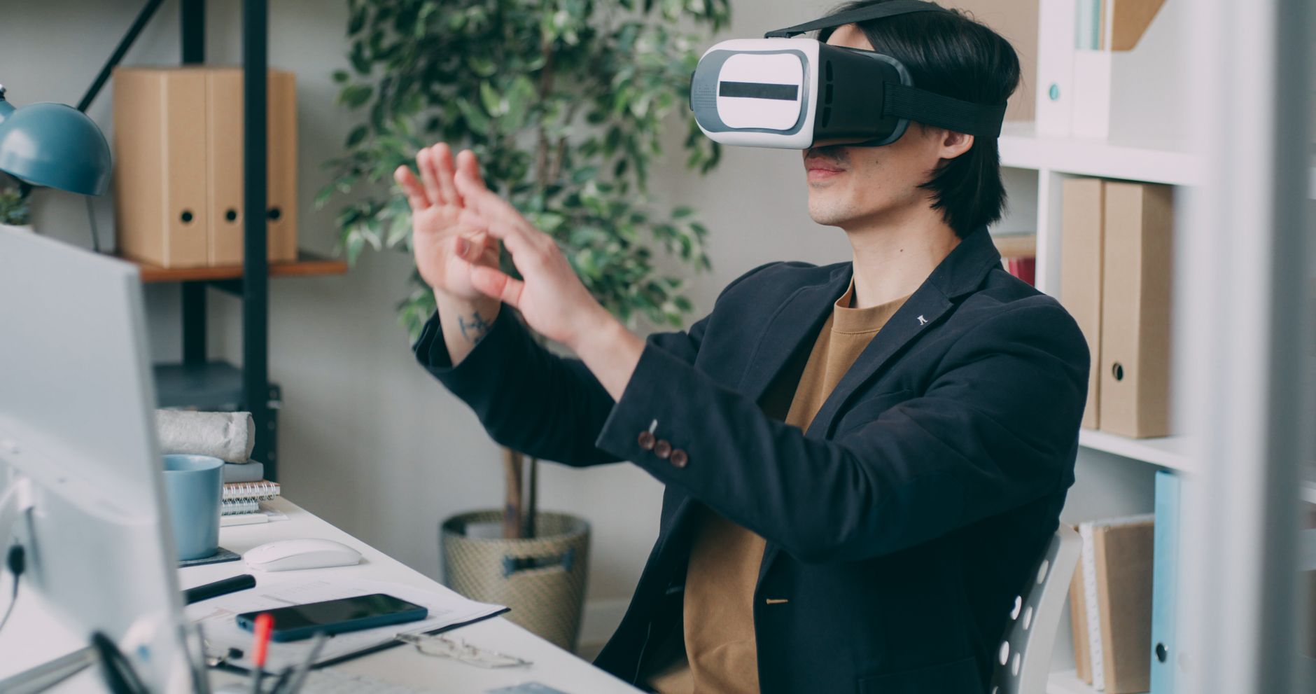 A Man In An Office Environment Using A Virtual Rea 2