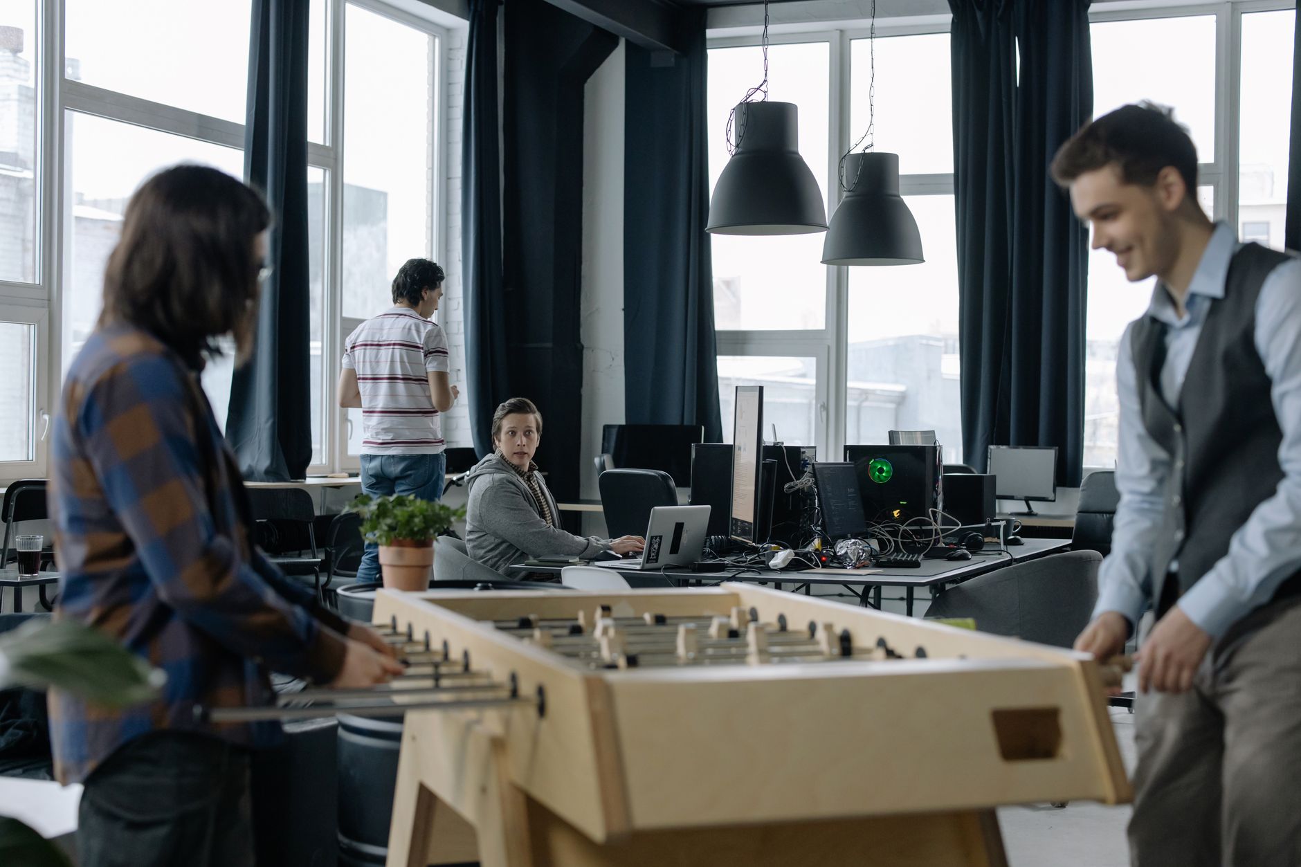 A Modern Office Environment Featuring A Foosball T 1