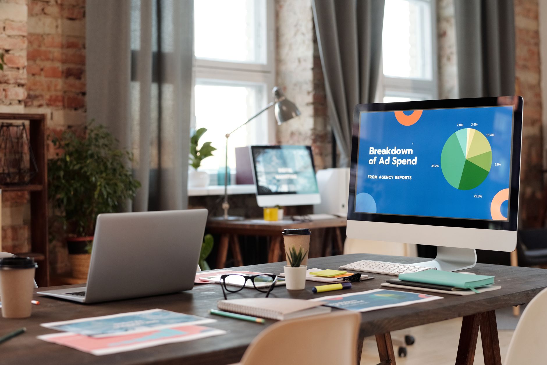 A Modern Office Workspace Featuring Computers Cha