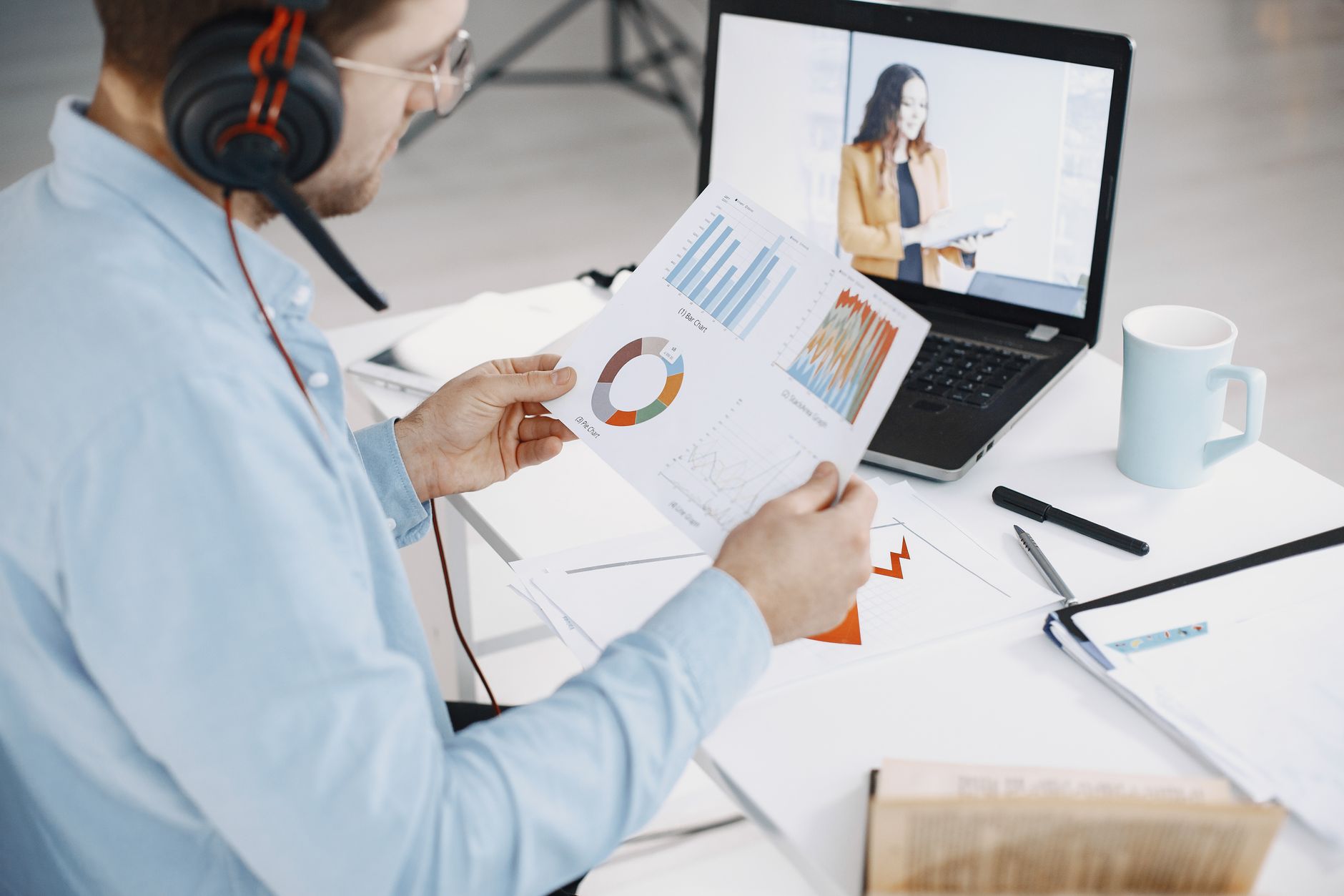 Man Reviewing Business Charts During A Remote Vide