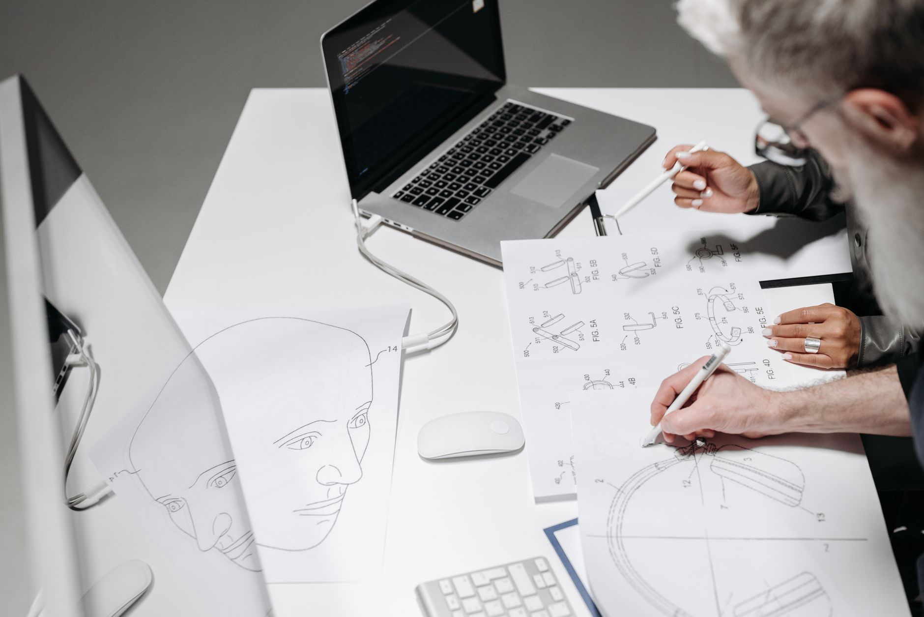 Team Working On Detailed Technical Drawings At A M